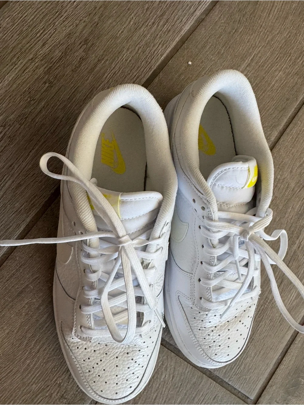 Nike White Low-Top Sneakers with Yellow Logo Accents